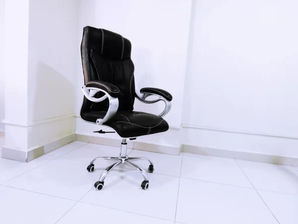 Comfortable executive office chair upholstered in black bonded leather with silver-finished accent. It’s Padded seat and armrests offer all day comfort and support, making it ideal for an office or conference room while it’s height adjustment feature, swivel, tilt-tension knob and smooth rolling casters for easy mobility