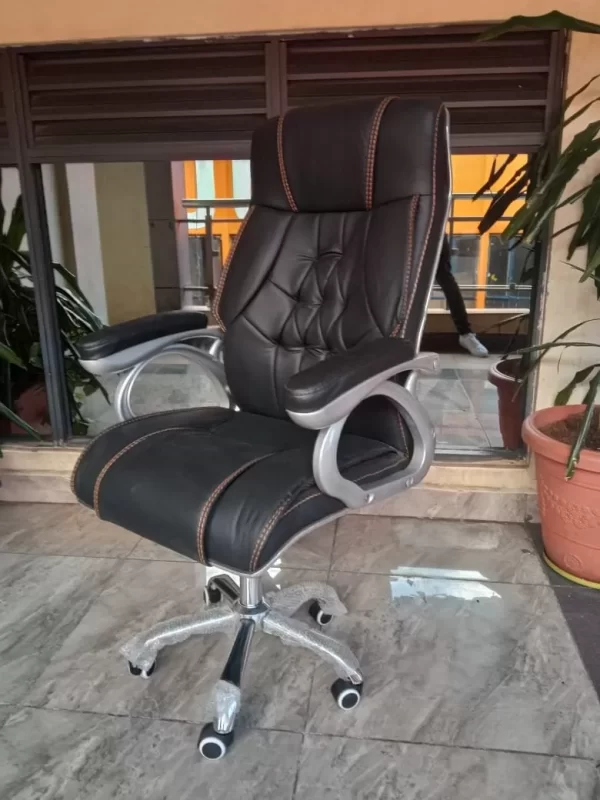 Check out our newest range of EXECUTIVE OFFICE CHAIRS suited to meet all your office and comfort needs. This is a posture friendly ergonomic office chair with a beautiful black leather back, black leather seat and black theme. The seat has wheels, is adjustable in height and the back for comfort and back support. High end executive back leather office chair,leather seating with 28kg/m3 density new foam, very strong & quality mesh back(black in colour), 100mm chrome gas lift for different heights, high quality aluminium five star base, high quality 60mm pu castors(wheels), synchronized mechanism with back tilt which is lockable at different positions for maximum/extra comfort, adjustable lumbar support, adjustable armrests lockable at different heights & adjustable headrest.shop online on Furniture Choice Kenya and get it delivered to your doorstep
