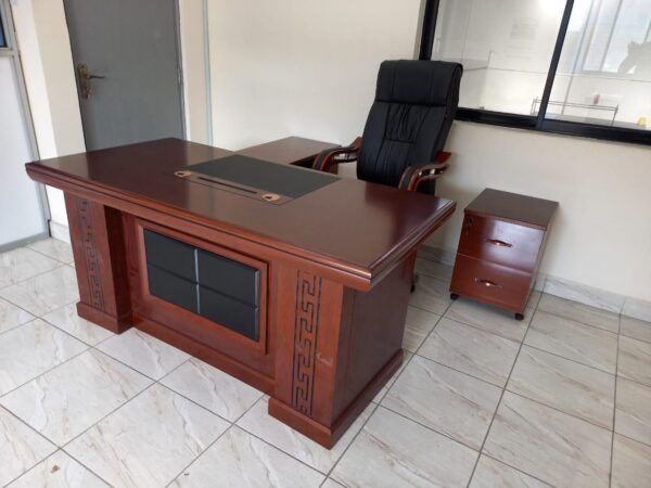 1.6m executive office desk, Black swivel adjustable barstool, Executive wooden cupboard, Metallic lockable cabinet with safe, Green medium back office chair, 5-seater executive office sofa, Square mahogany coffee table